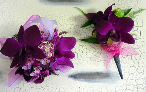 purple corsage and boutonniere for prom